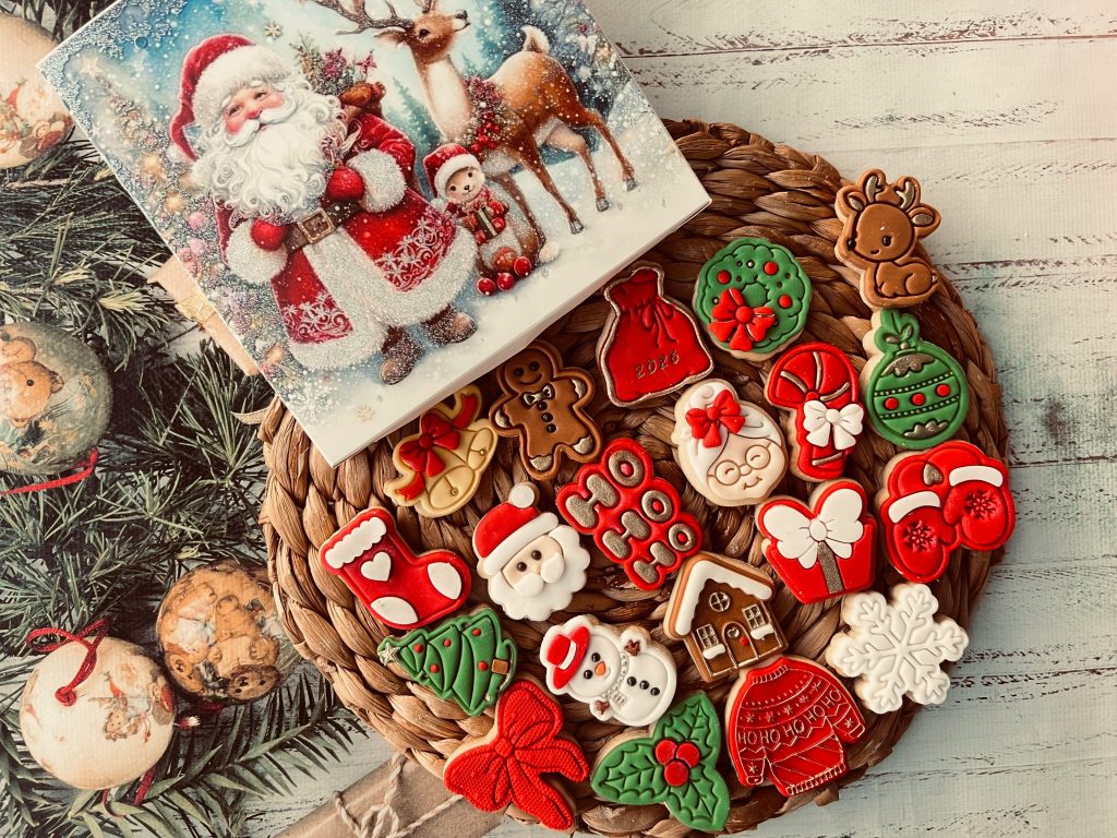 A festive display of Christmas cookies alongside a Santa illustration card.
